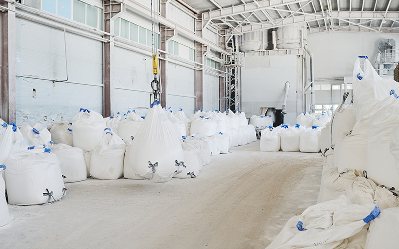 MAP bulk fertilizer stockpile in storage warehouse