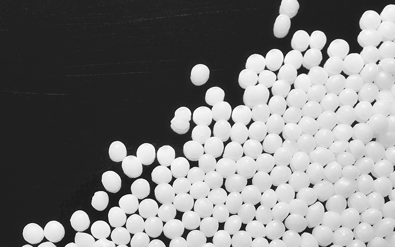 Urea nitrogen fertilizer prilled granules close up